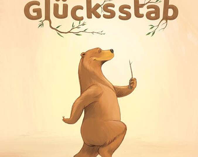 Bär hüpft zufrieden mit dem Glückstab in der Hand umher.